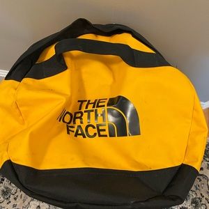 Large yellow north face duffel